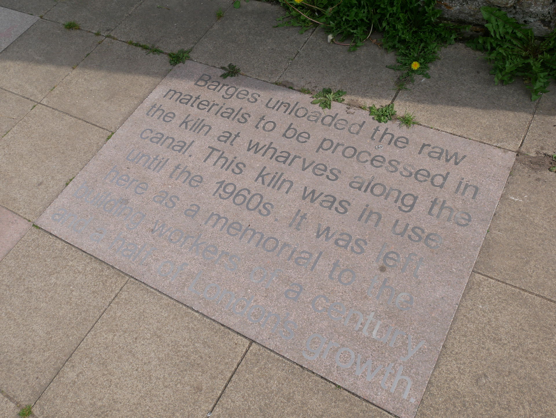 An epigraph around the base of the listed lime kiln in Burgess …