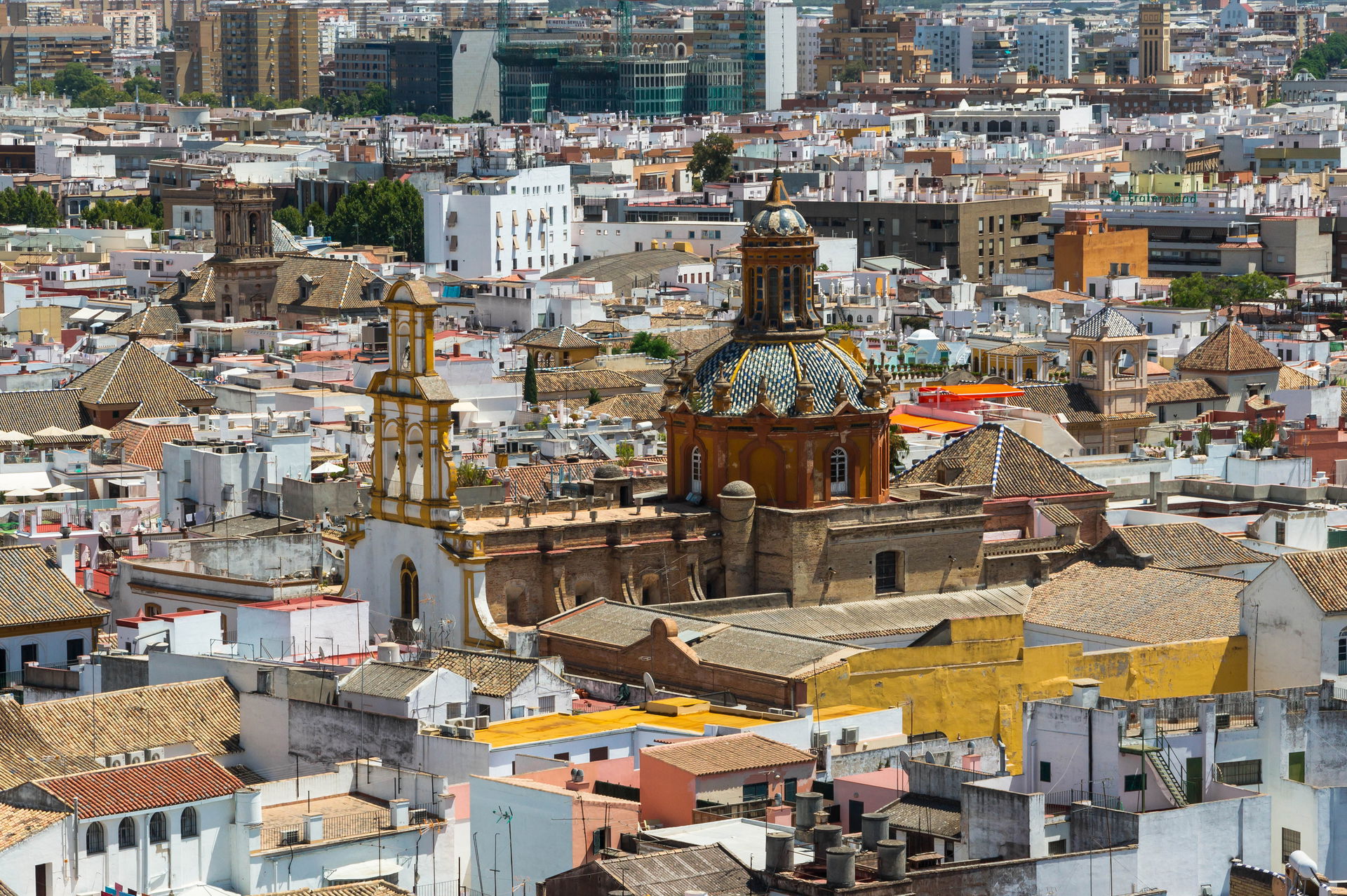The church "Santa Cruz" merging from roofs, seen from the "Gira…